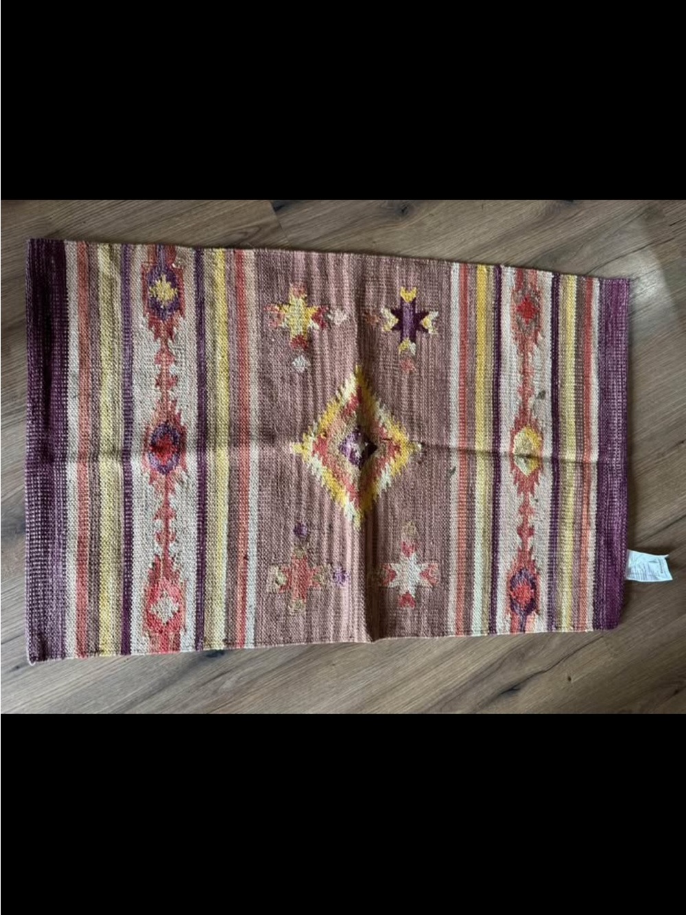 World Market handwoven Southwestern Accent Rug in Pink, Yellow & Purple